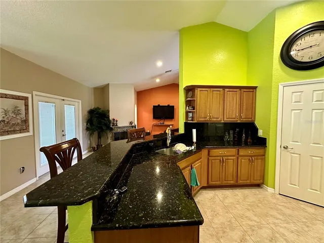 a kitchen with a table and chairs