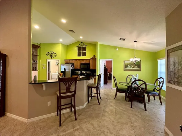 a view of a dining room with furniture