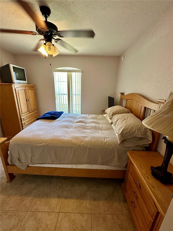 2576 Southwest 175 Loop Ocala, FL 34473 - Photo 23 of 62 a bedroom with a bed and window
