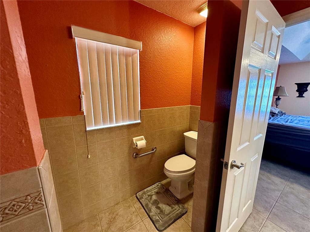 2576 Southwest 175 Loop Ocala, FL 34473 - Photo 31 of 62 a bathroom with a sink and a toilet