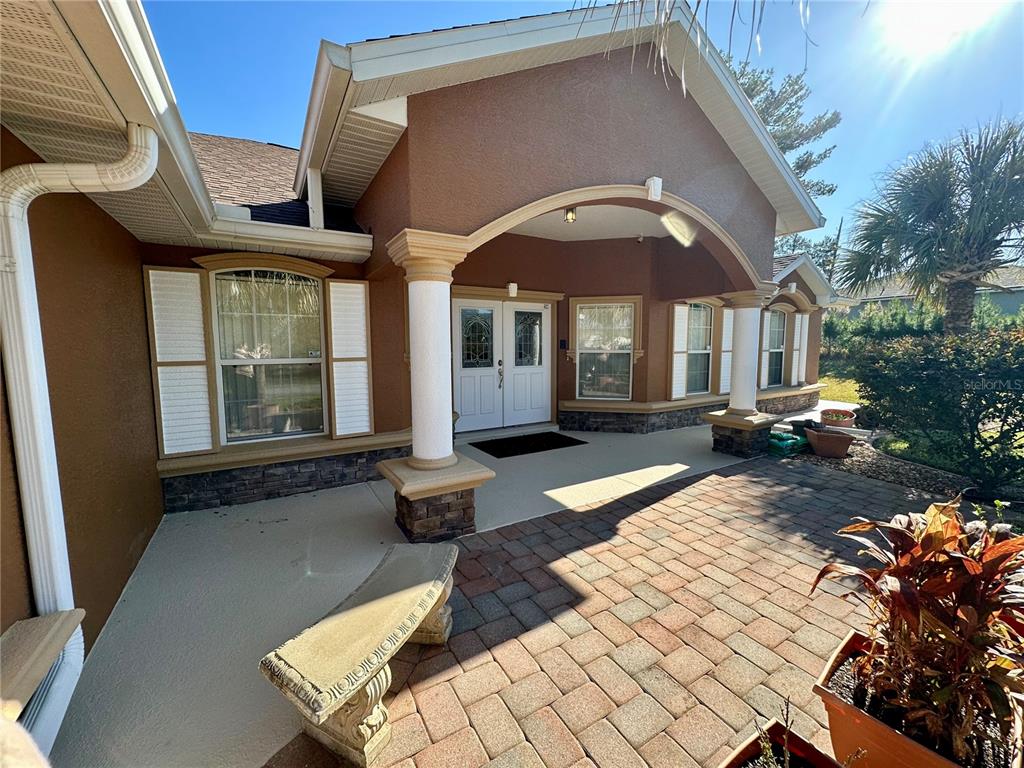 2576 Southwest 175 Loop Ocala, FL 34473 - Photo 45 of 62 a front view of a house with a yard