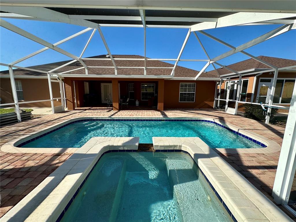 2576 Southwest 175 Loop Ocala, FL 34473 - Photo 48 of 62 a view of a house with swimming pool