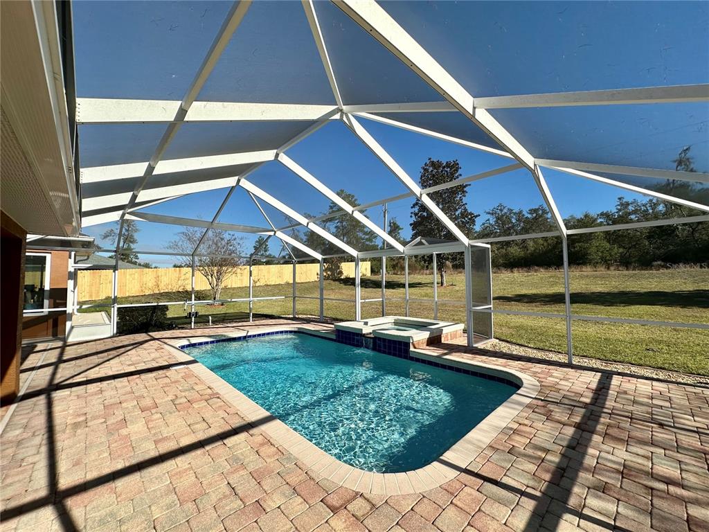 2576 Southwest 175 Loop Ocala, FL 34473 - Photo 52 of 62 a view of a swimming pool with an outdoor seating