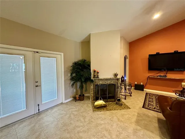a view of a livingroom with furniture and a flat screen tv