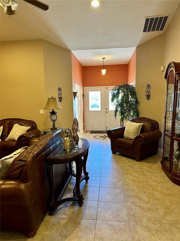 2576 Southwest 175 Loop Ocala, FL 34473 - Photo 8 of 62 a living room with furniture and a window
