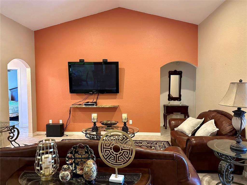 2576 Southwest 175 Loop Ocala, FL 34473 - Photo 9 of 62 a view of a livingroom with furniture and a flat screen tv
