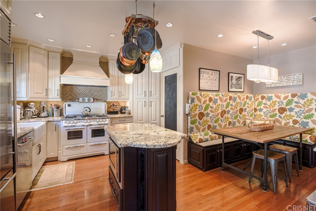 1055 La Loma Road Pasadena, CA 91105 - Photo 13 of 29 a bedroom with a bed and wooden floor