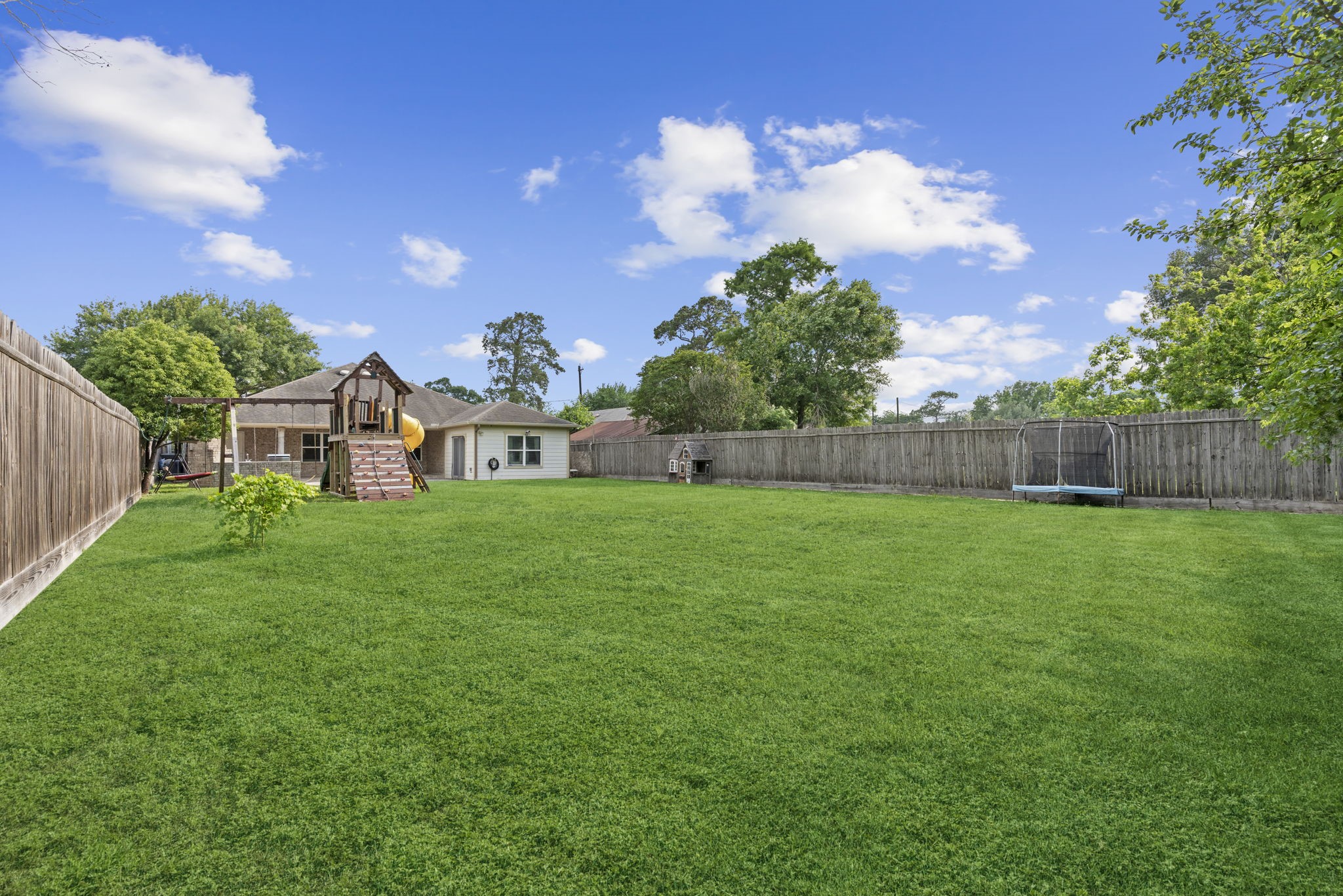 631 Apache Street Houston, TX 77022 - Photo 12 of 45 a view of a house with a backyard