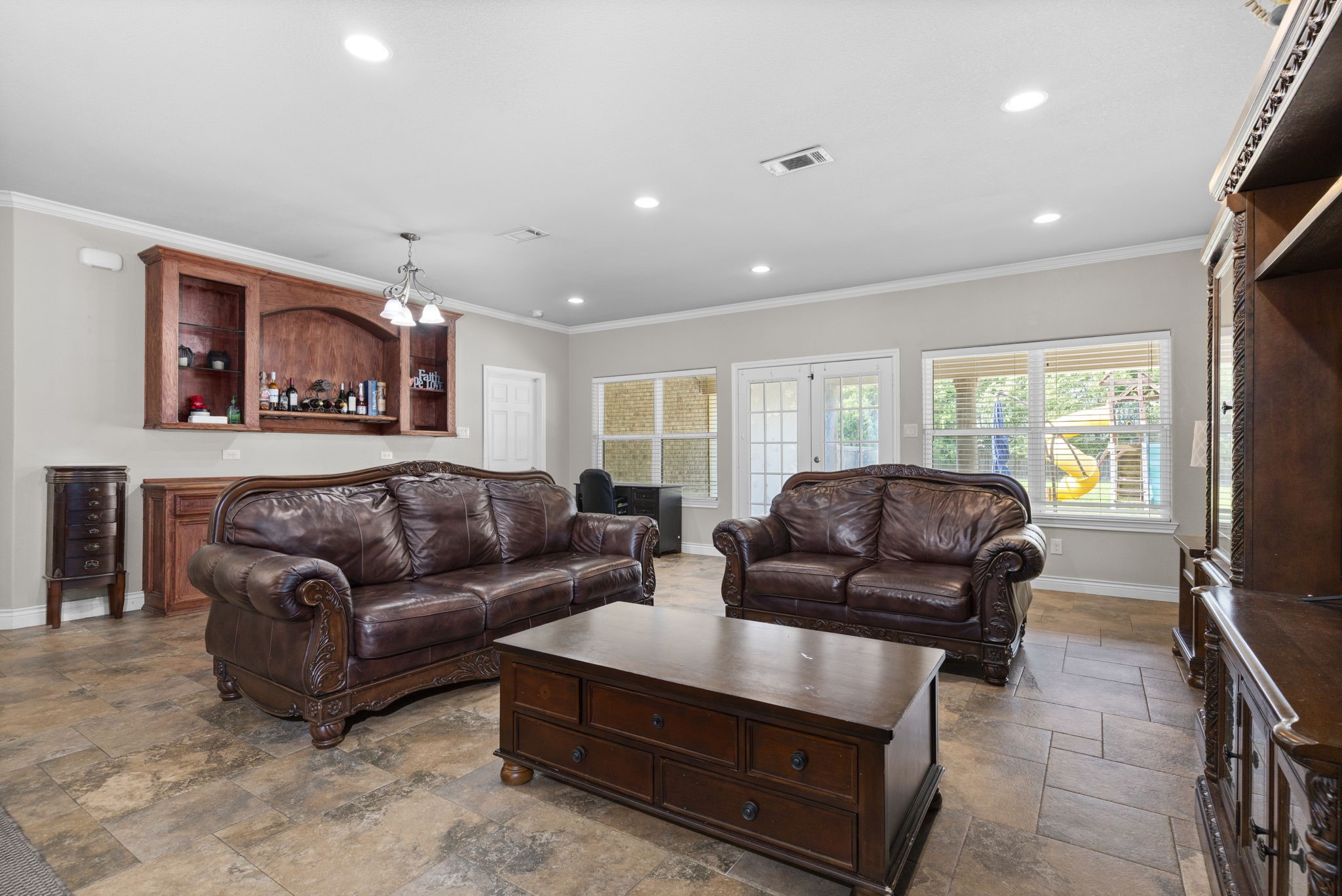 631 Apache Street Houston, TX 77022 - Photo 19 of 45 a living room with furniture window and a flat screen tv