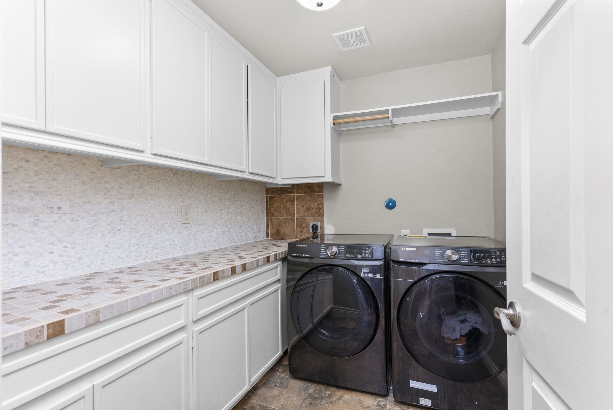 631 Apache Street Houston, TX 77022 - Photo 28 of 45 a utility room with sink dryer and washer