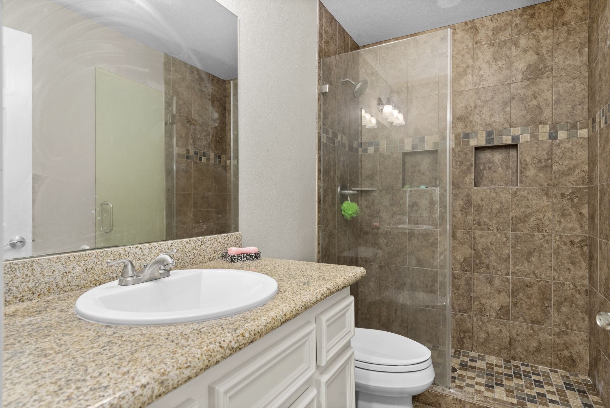 631 Apache Street Houston, TX 77022 - Photo 31 of 45 a bathroom with a sink and a mirror