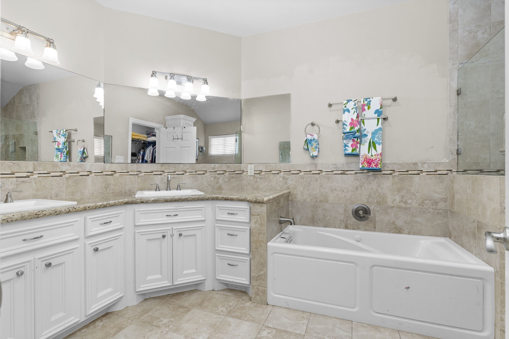631 Apache Street Houston, TX 77022 - Photo 34 of 45 a bathroom with a sink a vanity and bathtub