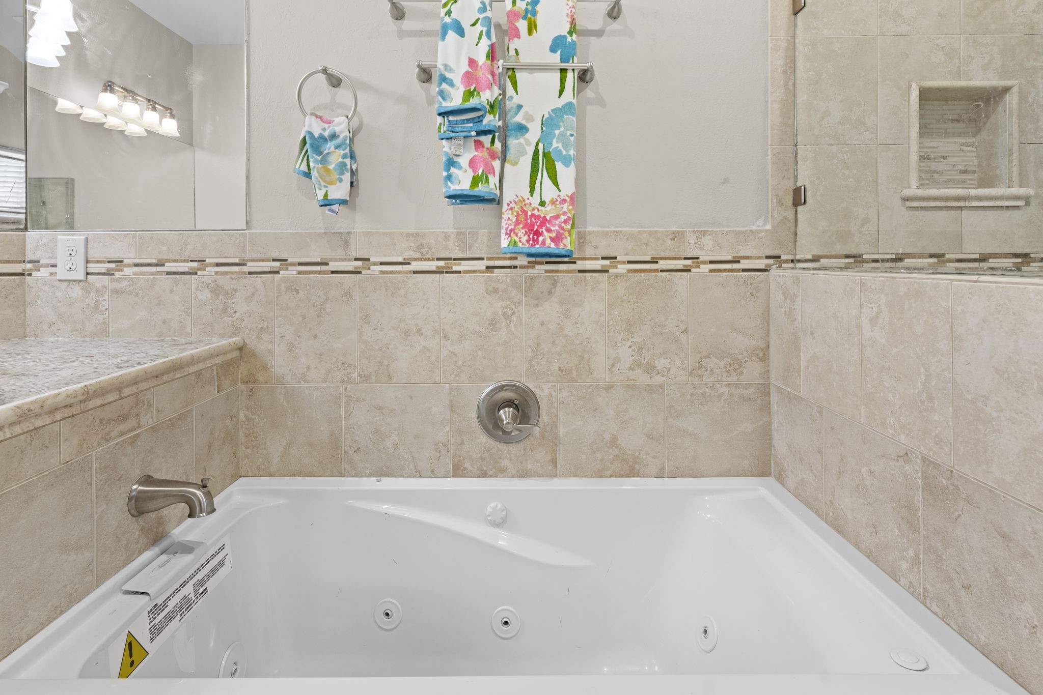 631 Apache Street Houston, TX 77022 - Photo 36 of 45 a bathroom with a bathtub and a shower