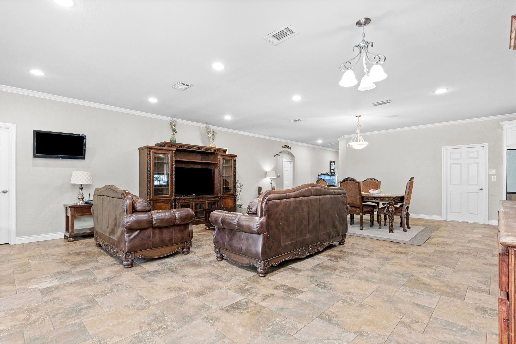 631 Apache Street Houston, TX 77022 - Photo 43 of 45 a living room with furniture and a flat screen tv