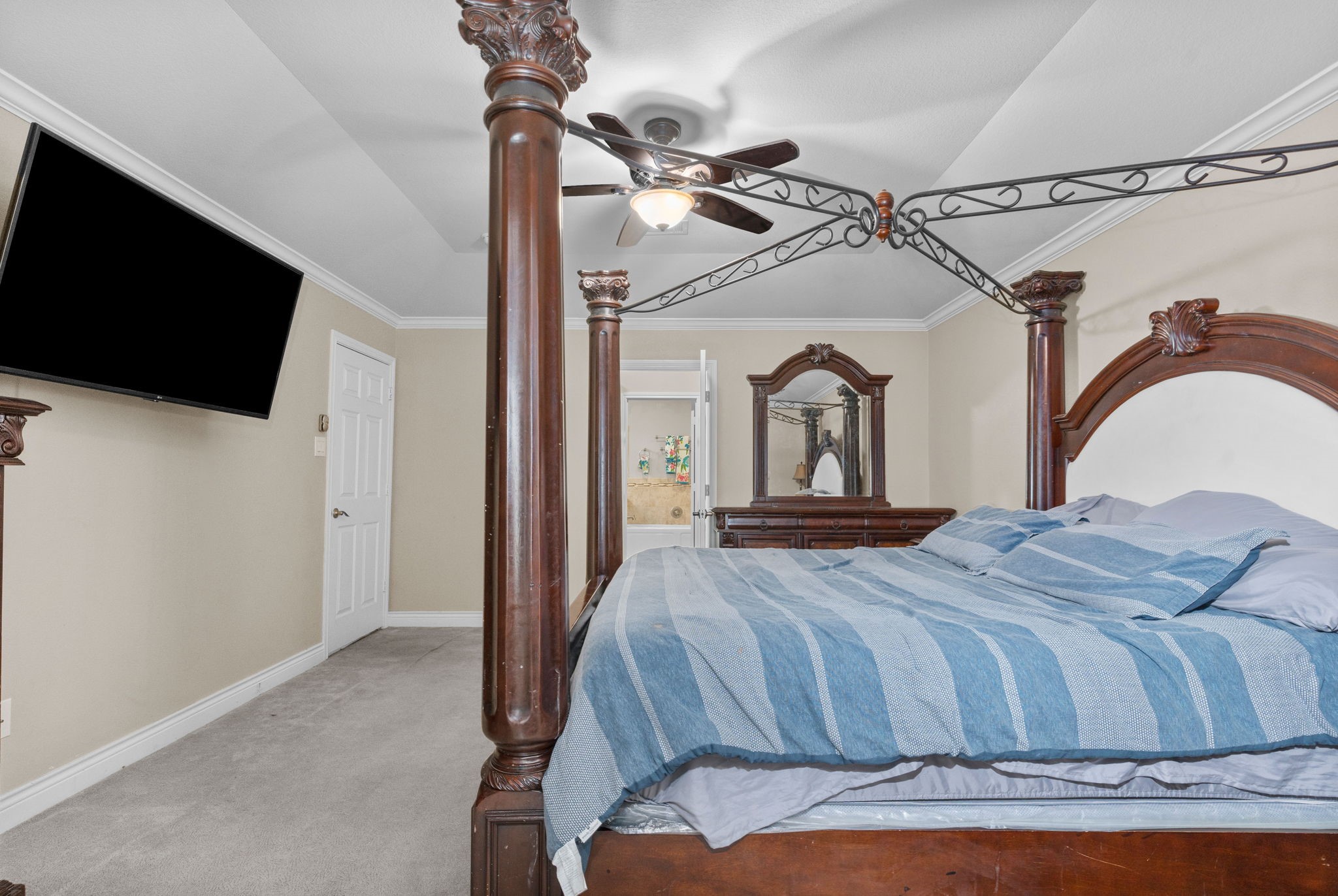 631 Apache Street Houston, TX 77022 - Photo 44 of 45 a bedroom with a bed and a flat screen tv