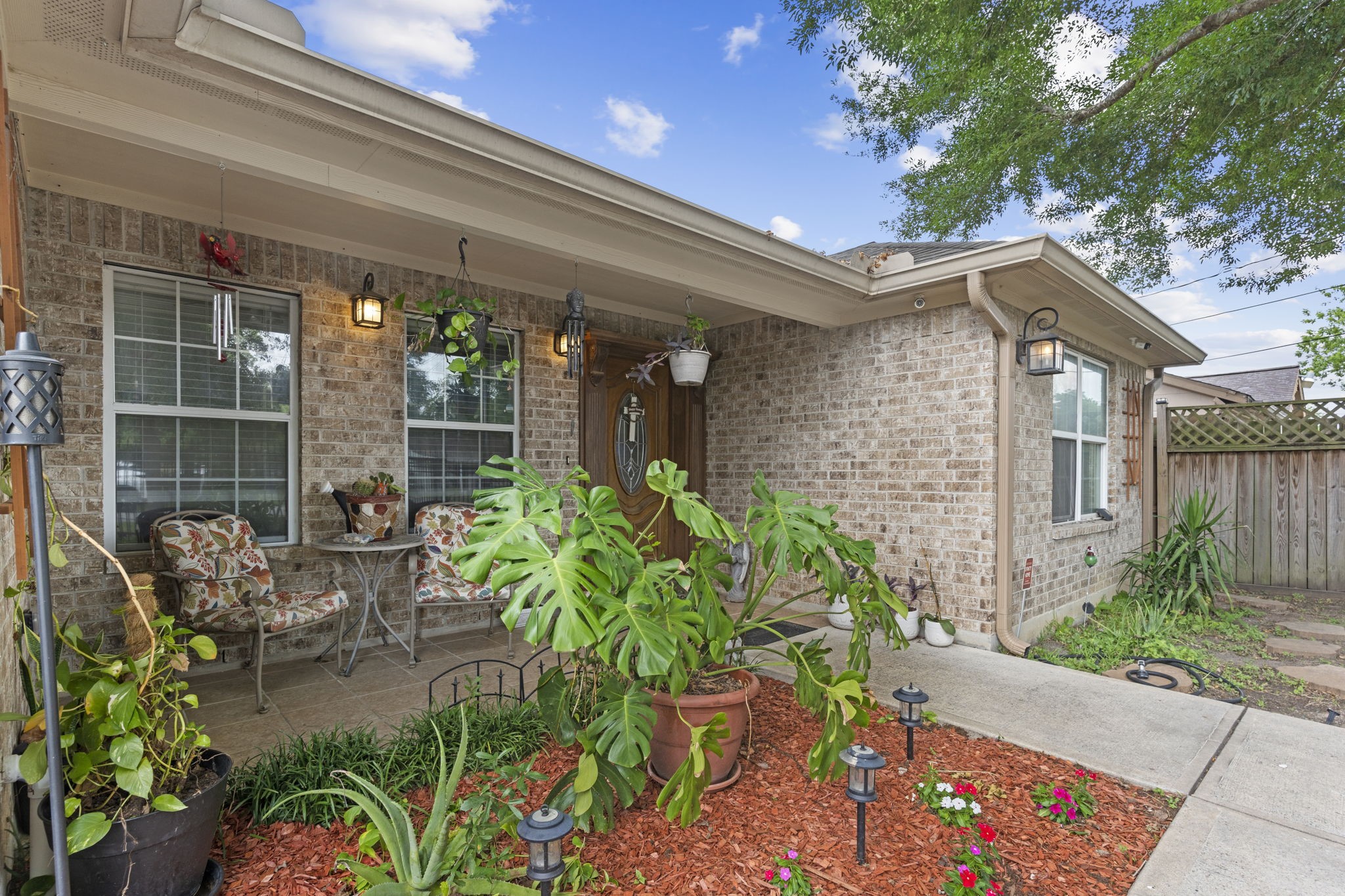 631 Apache Street Houston, TX 77022 - Photo 7 of 45 a backyard of a house with outdoor seating and green space