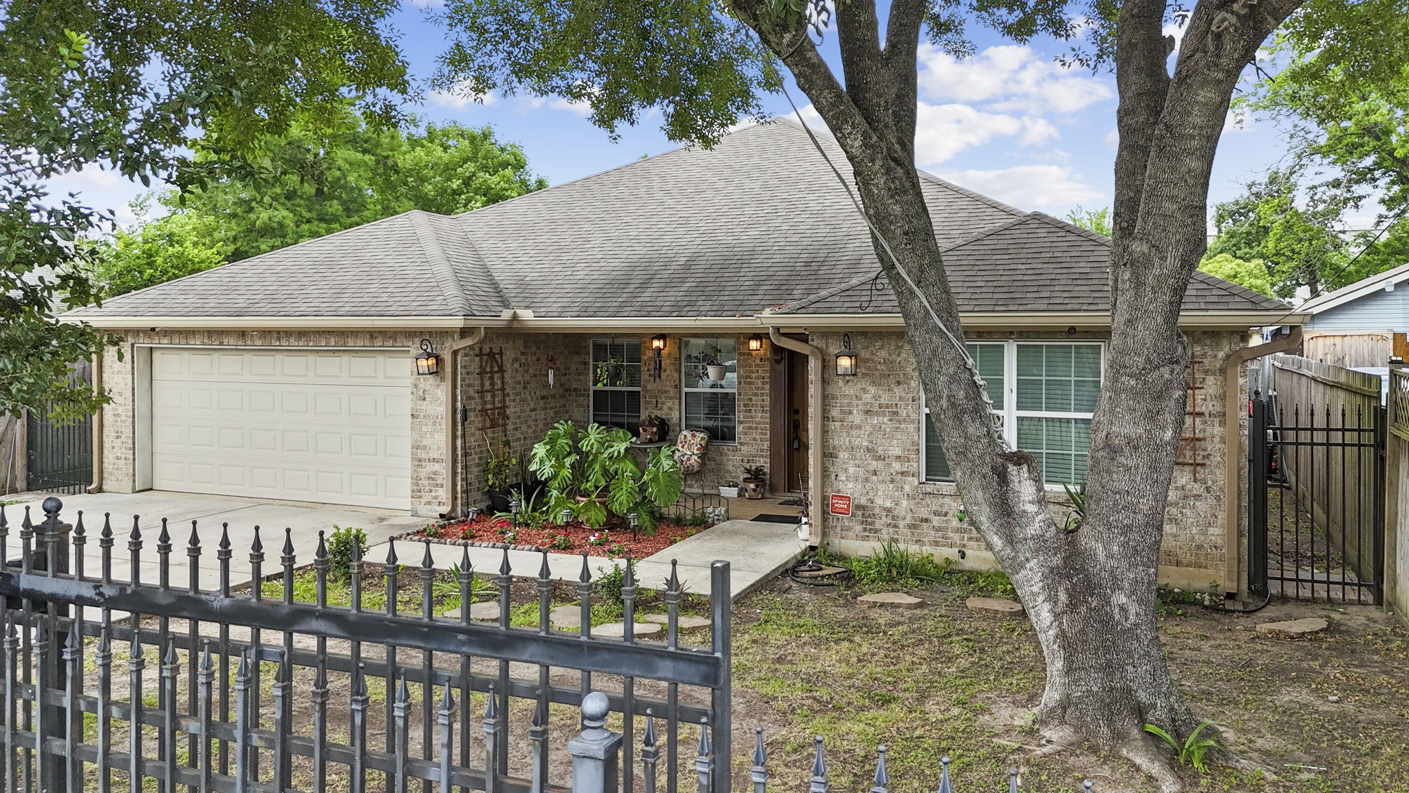 631 Apache Street Houston, TX 77022 - Photo 9 of 45 a front view of house with a garden