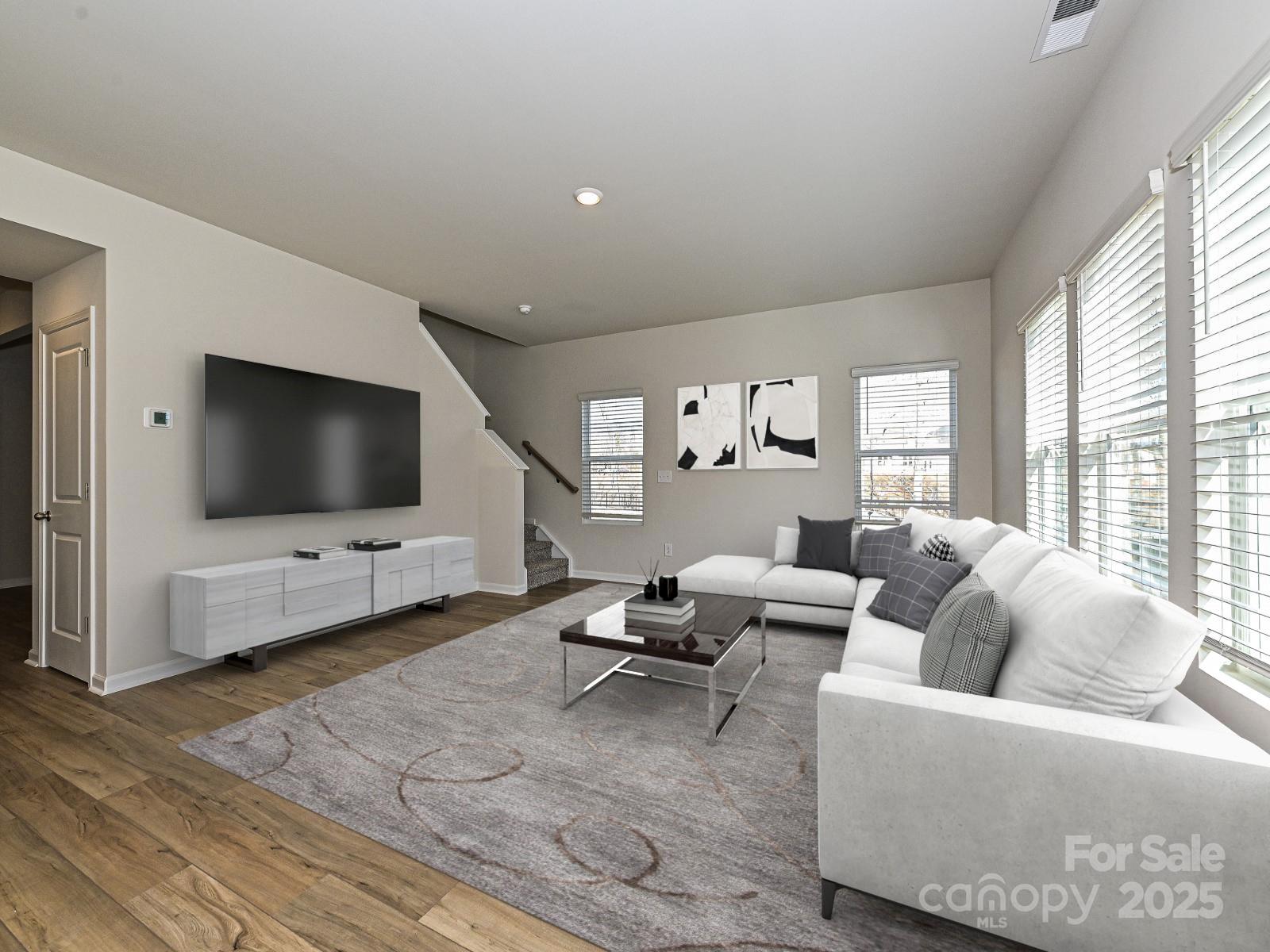 202 Nelson Crk Road Mocksville, NC 27028 - Photo 4 of 11 a living room with furniture and a flat screen tv