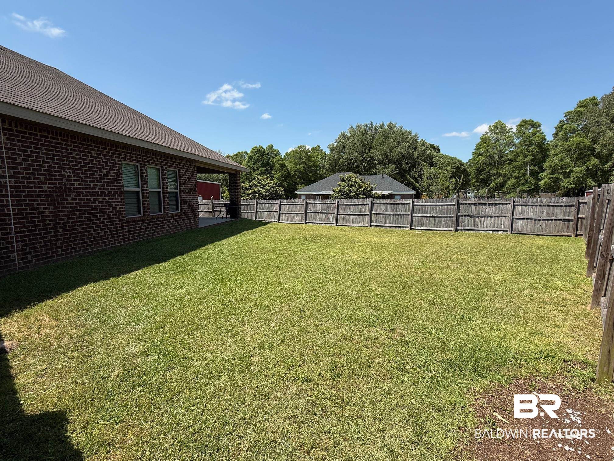 2996 Notsram Court Mobile, AL 36695 - Photo 14 of 16 View of yard with a fenced backyard