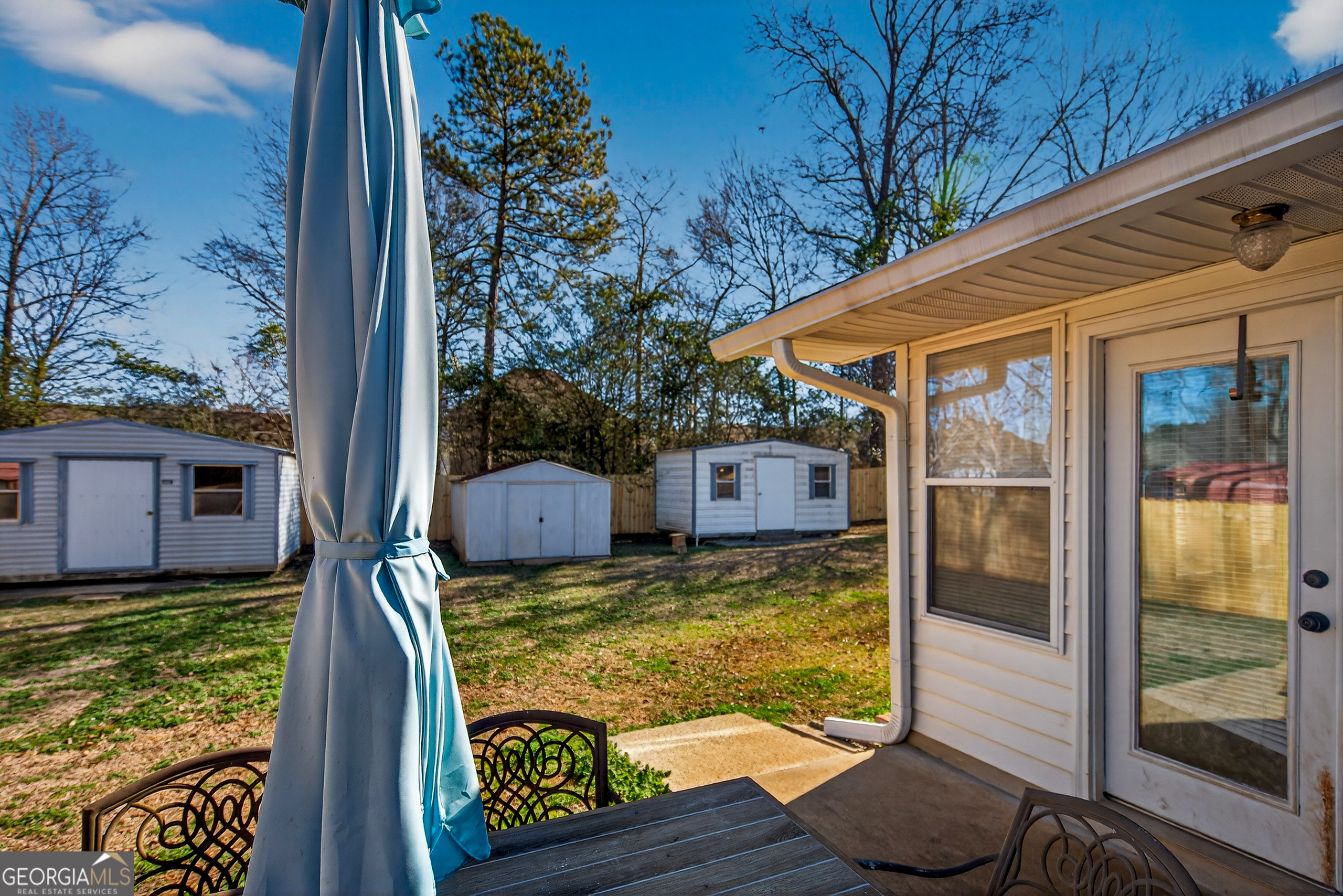 2404 19th Avenue Valley, AL 36854 - Photo 21 of 24 a view of a balcony with chair and floor to ceiling window yard