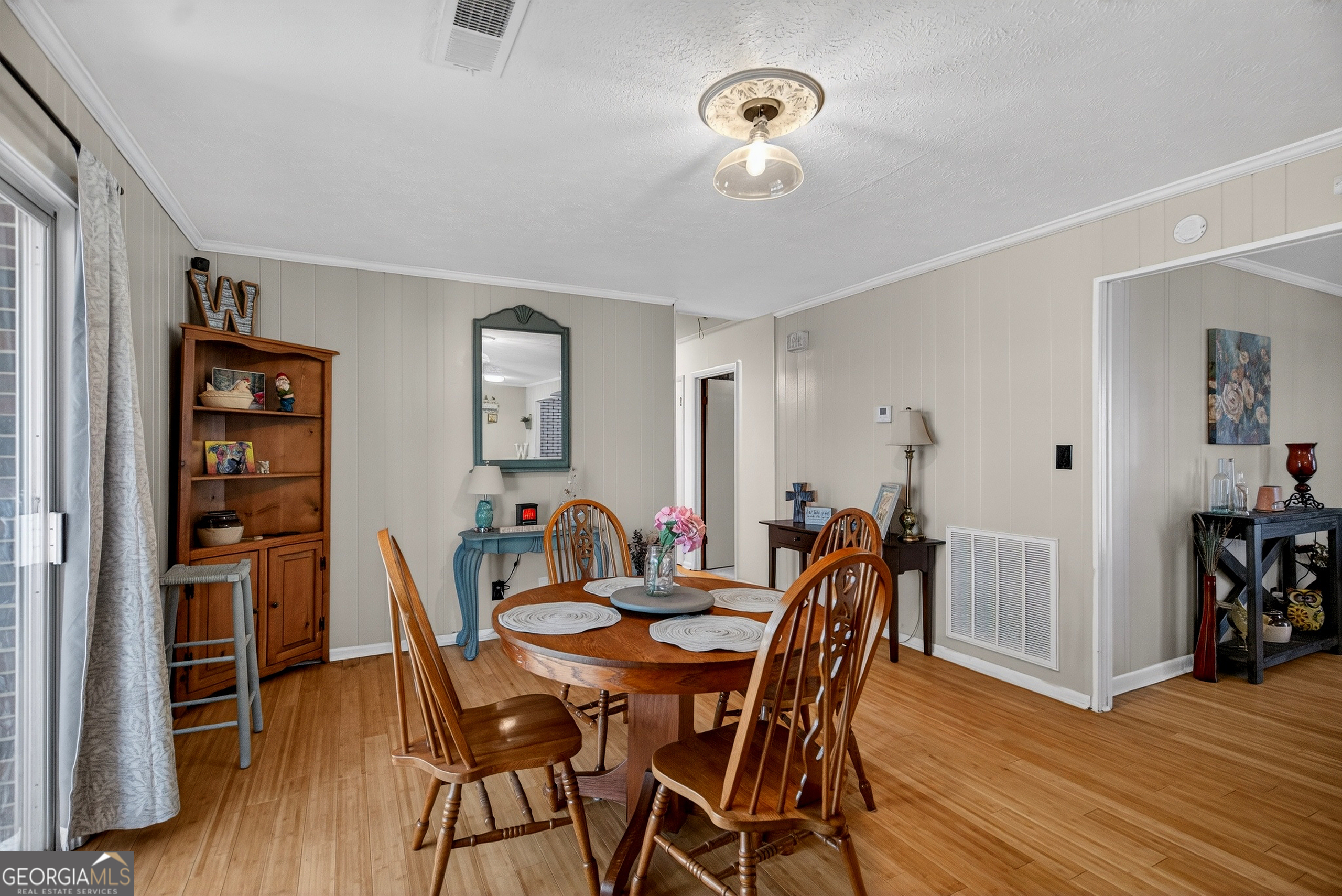 2404 19th Avenue Valley, AL 36854 - Photo 7 of 24 a view of a dining room with furniture and wooden floor