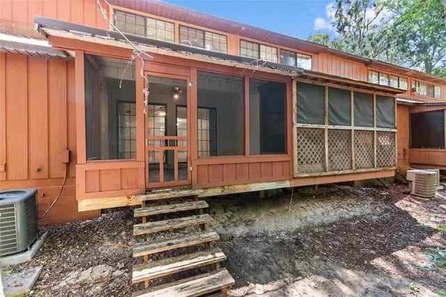 a front view of a house with a large window