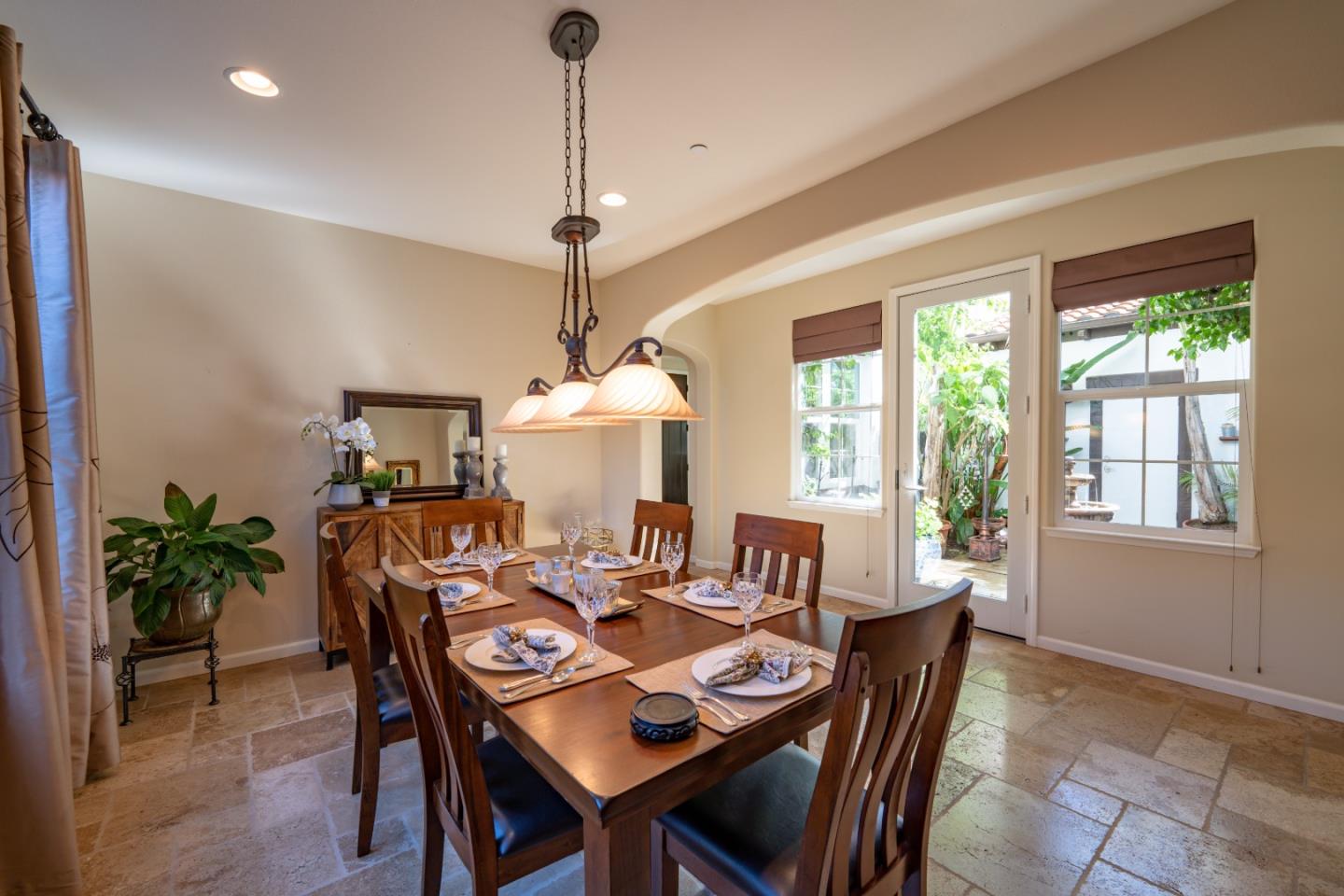 7683 Braid Court Gilroy, CA 95020 - Photo 11 of 69 a view of a dining room and livingroom with furniture wooden floor a chandelier