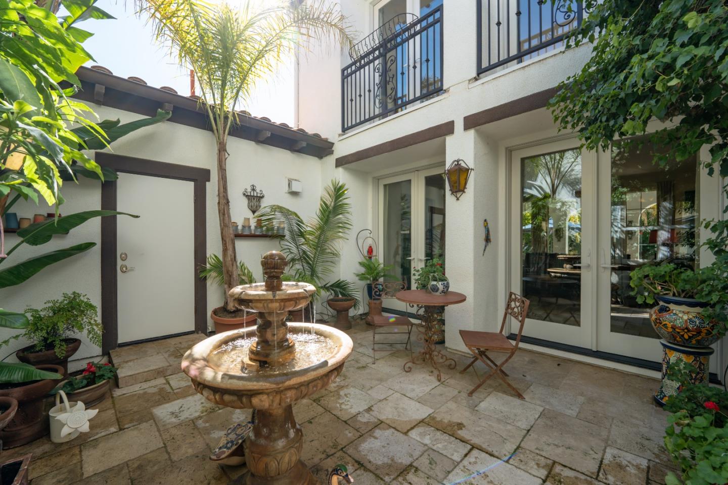 7683 Braid Court Gilroy, CA 95020 - Photo 12 of 69 a backyard of a house with table and chairs potted plants