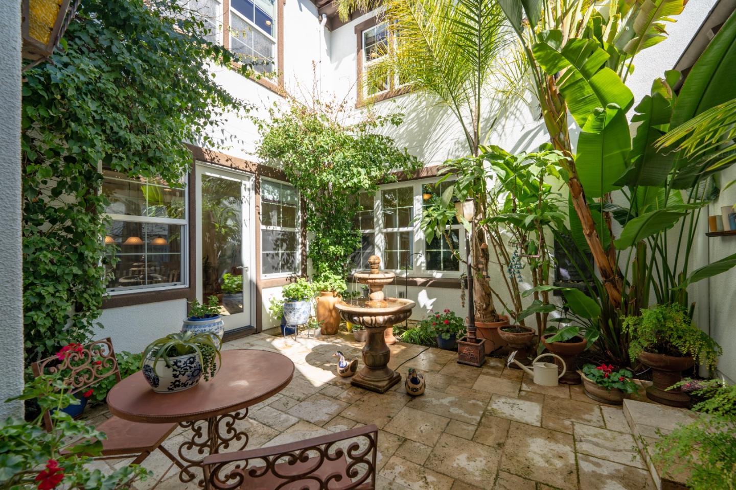 7683 Braid Court Gilroy, CA 95020 - Photo 13 of 69 a view of a patio with couches and potted plants