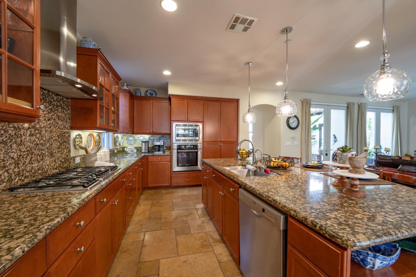 7683 Braid Court Gilroy, CA 95020 - Photo 16 of 69 a large kitchen with kitchen island a large island in it