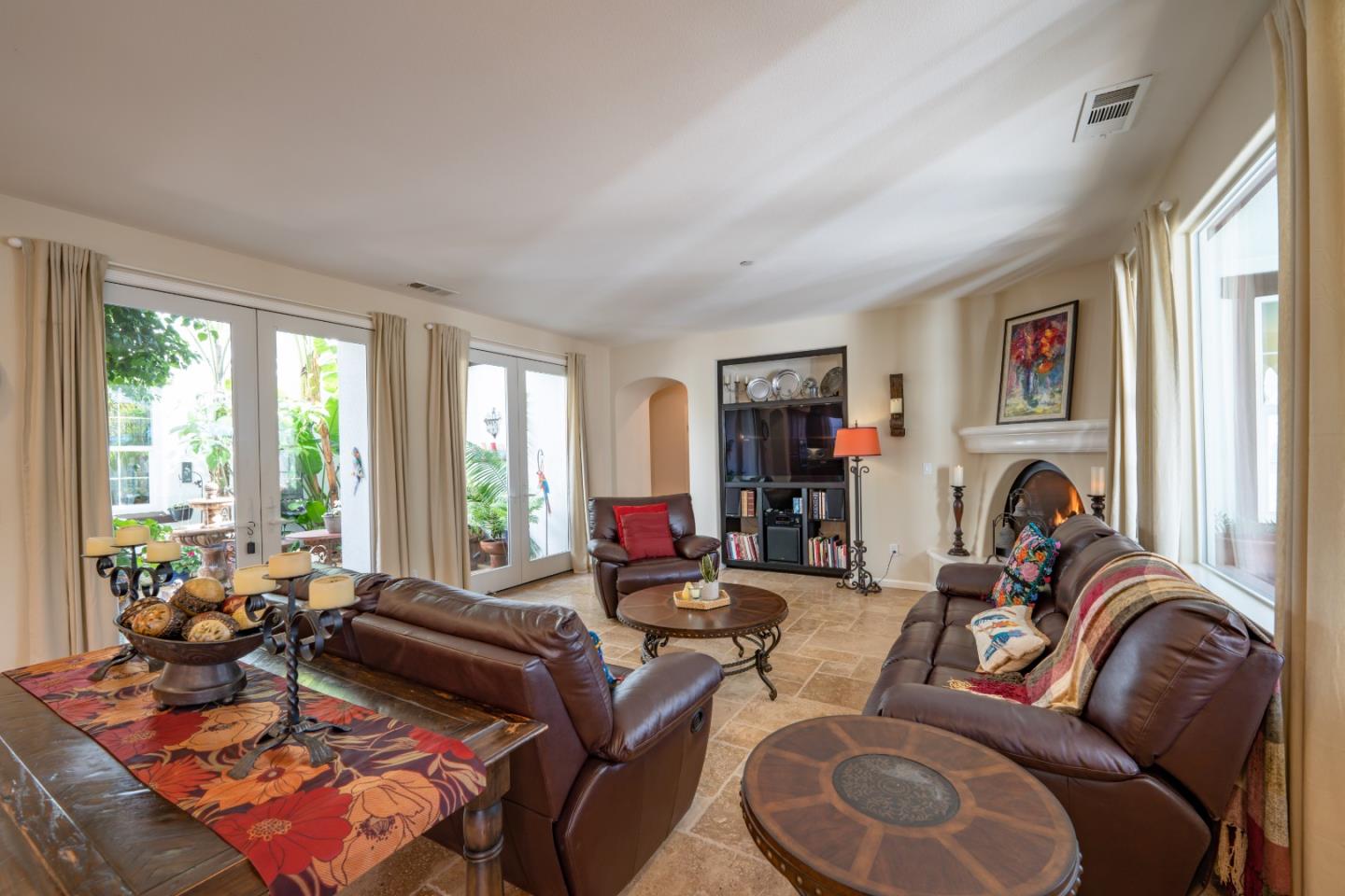 7683 Braid Court Gilroy, CA 95020 - Photo 22 of 69 a living room with furniture a large window and a flat screen tv