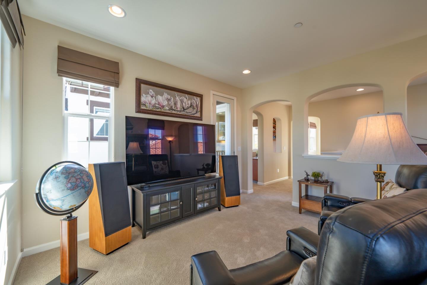 7683 Braid Court Gilroy, CA 95020 - Photo 32 of 69 a living room with furniture and a flat screen tv