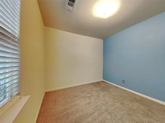 a white toilet sitting next to a bath tub