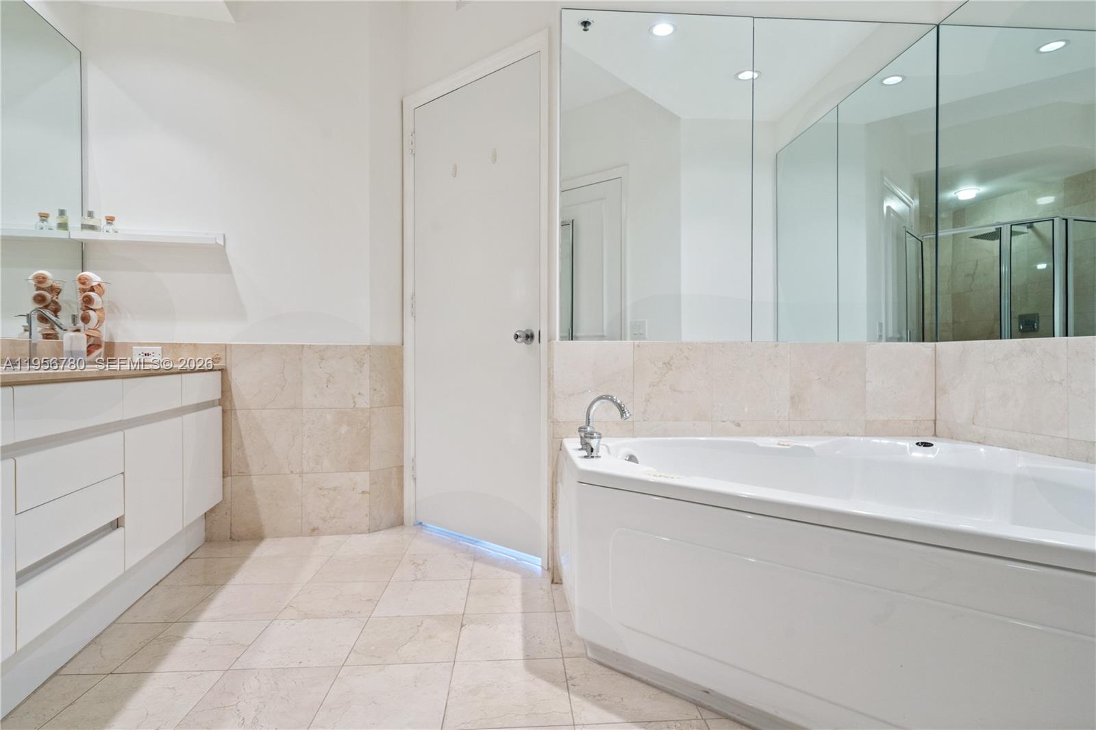 808 Brickell Key Drive, Unit 3304 Miami, FL 33131 - Photo 17 of 60 a bathroom with a bathtub and a sink