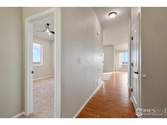 a view of a bathroom from the hallway