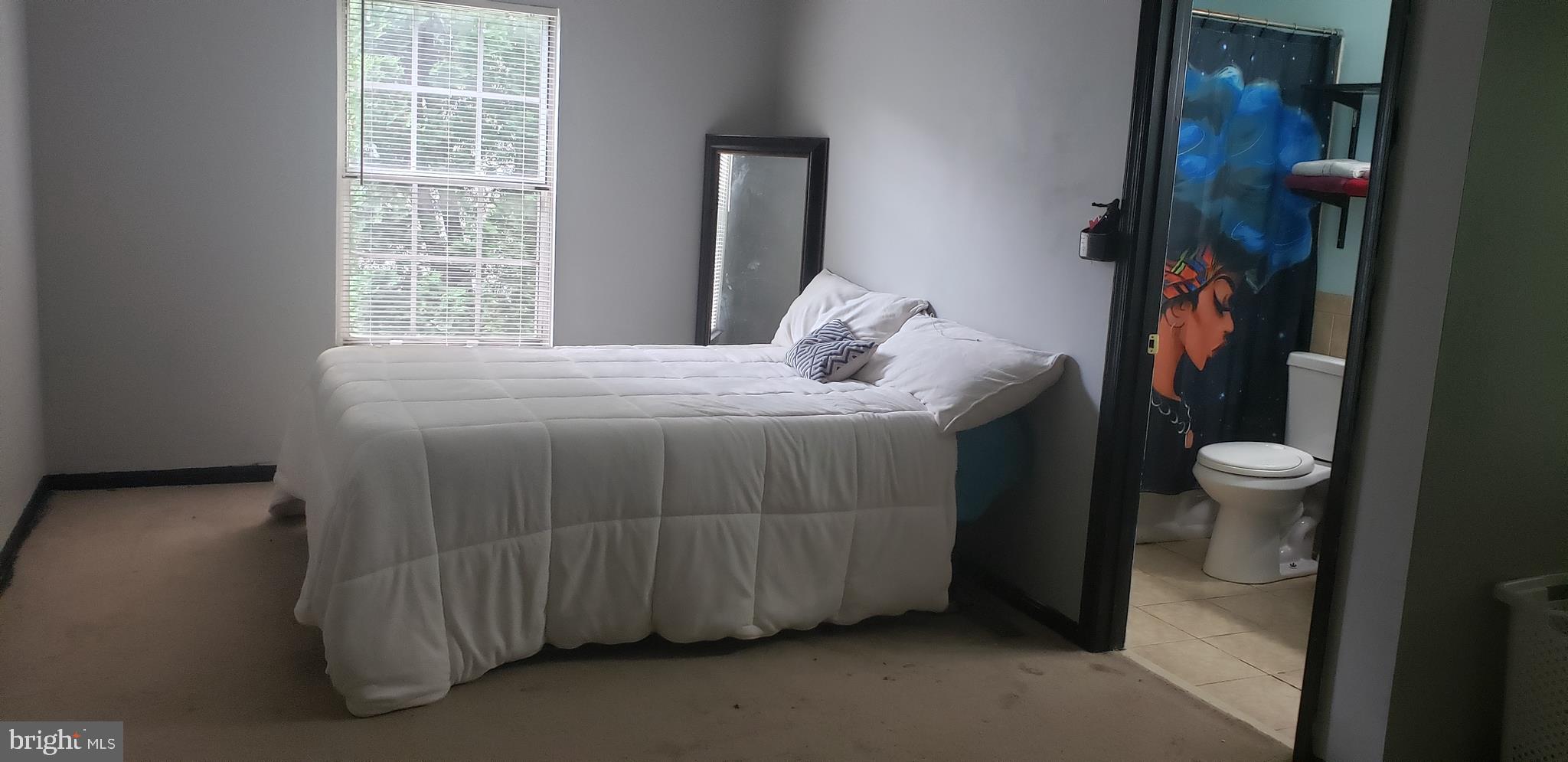 14526 Banquo Terrace, Unit 72 Silver Spring, MD 20906 - Photo 13 of 24 a bedroom with a bed and a window