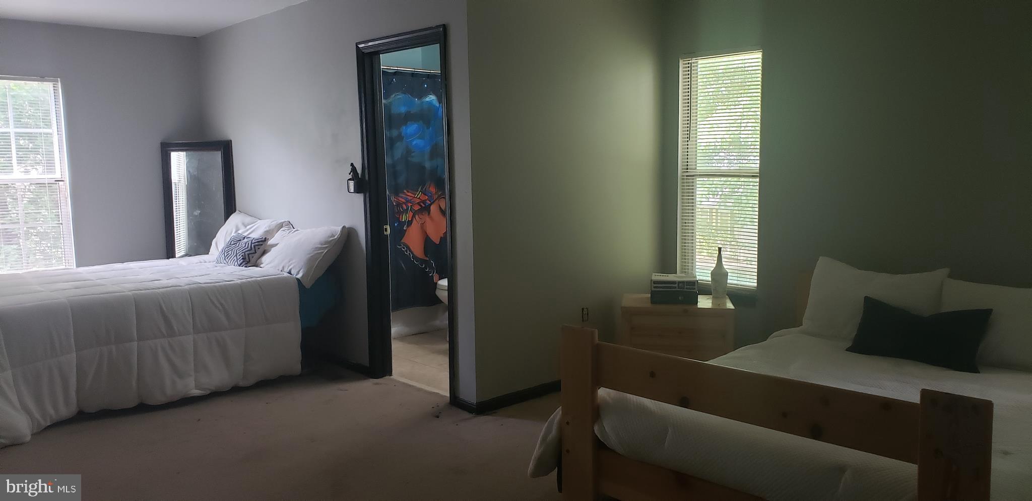 14526 Banquo Terrace, Unit 72 Silver Spring, MD 20906 - Photo 14 of 24 a bedroom with a bed and window