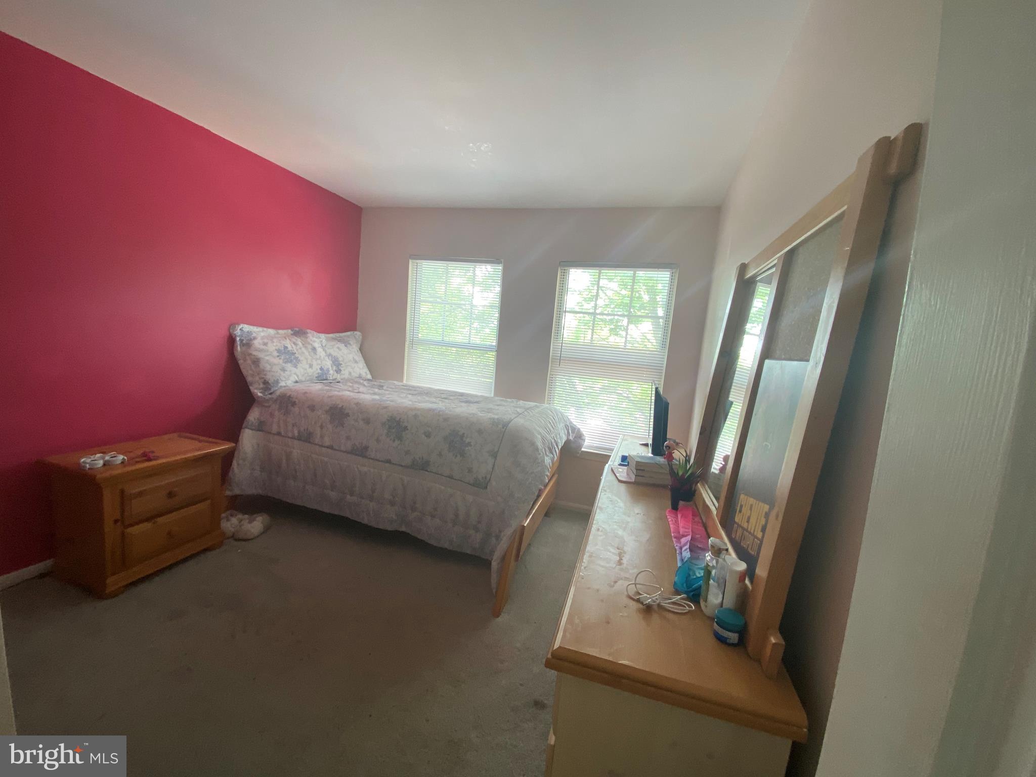 14526 Banquo Terrace, Unit 72 Silver Spring, MD 20906 - Photo 19 of 24 a bedroom with a bed and wooden floor