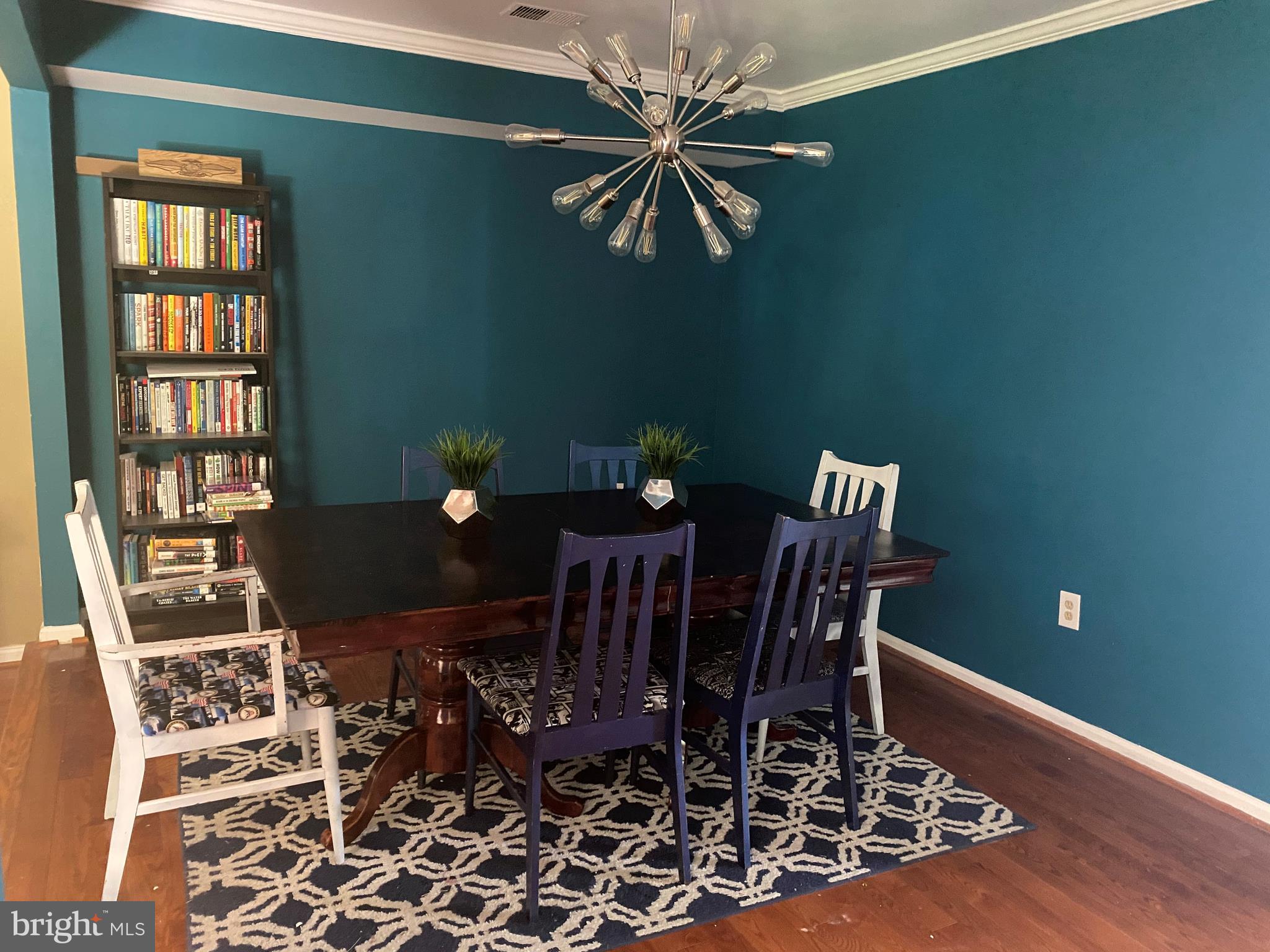 14526 Banquo Terrace, Unit 72 Silver Spring, MD 20906 - Photo 7 of 24 a view of a dining room with furniture and chandelier