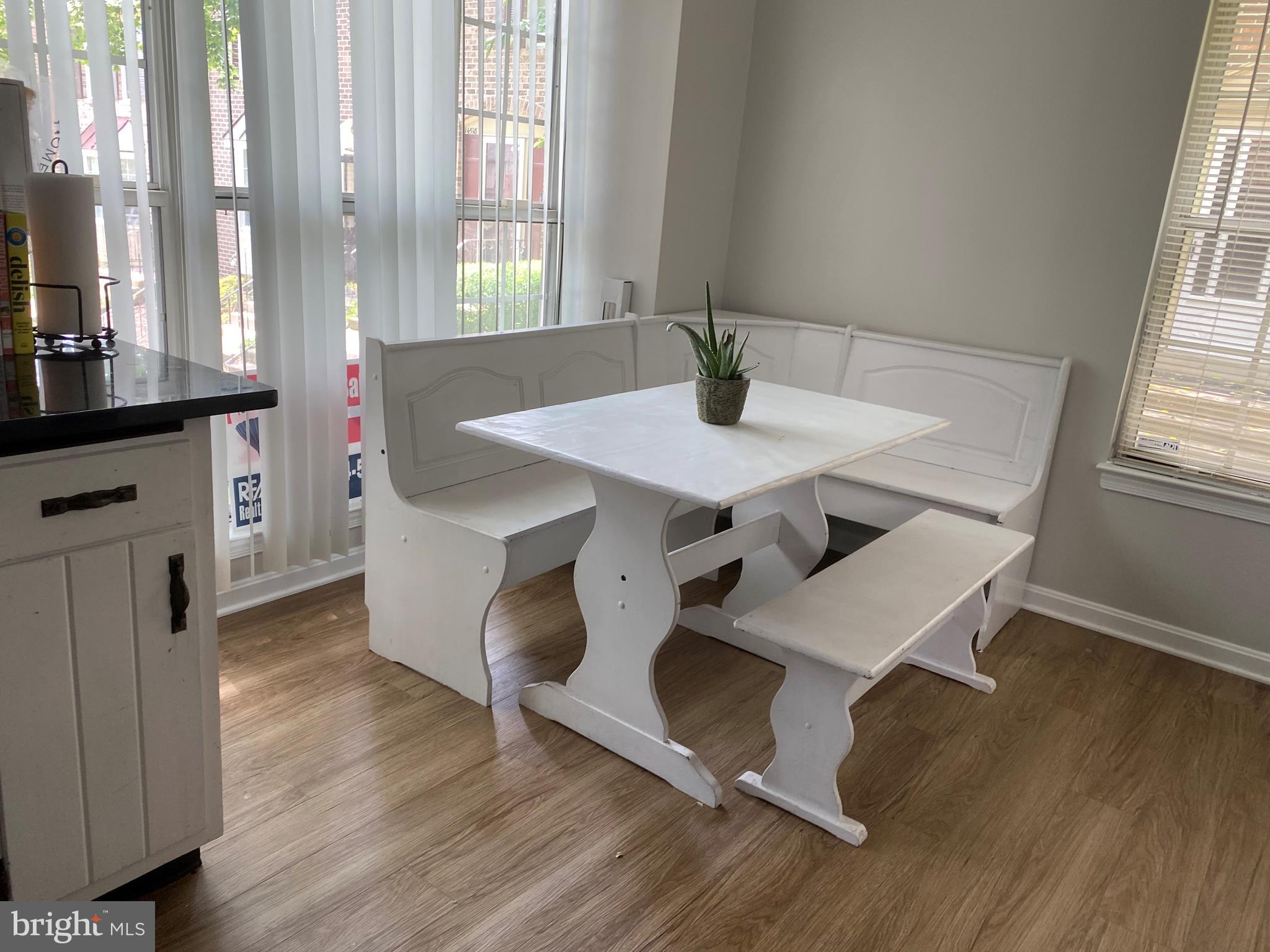 14526 Banquo Terrace, Unit 72 Silver Spring, MD 20906 - Photo 10 of 24 a kitchen with a sink cabinets and wooden floor