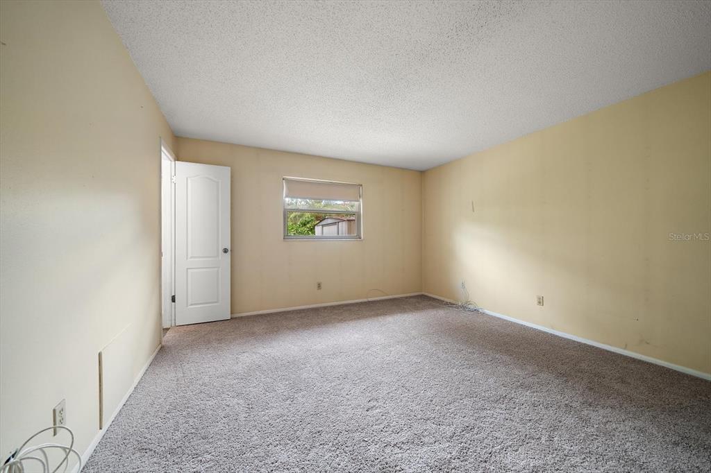 2850 Spring Lake Drive Clearwater, FL 33759 - Photo 17 of 37 an empty room with a window