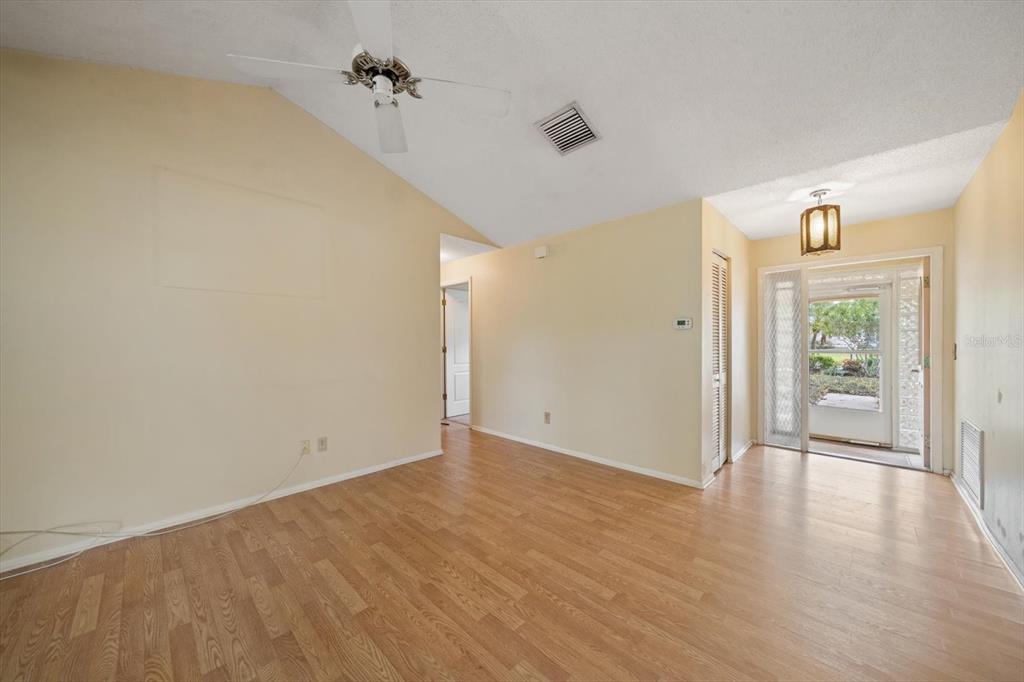 2850 Spring Lake Drive Clearwater, FL 33759 - Photo 21 of 37 wooden floor in an empty room