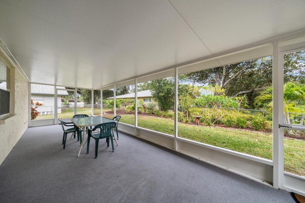 2850 Spring Lake Drive Clearwater, FL 33759 - Photo 22 of 37 a dining room with furniture and outdoor view