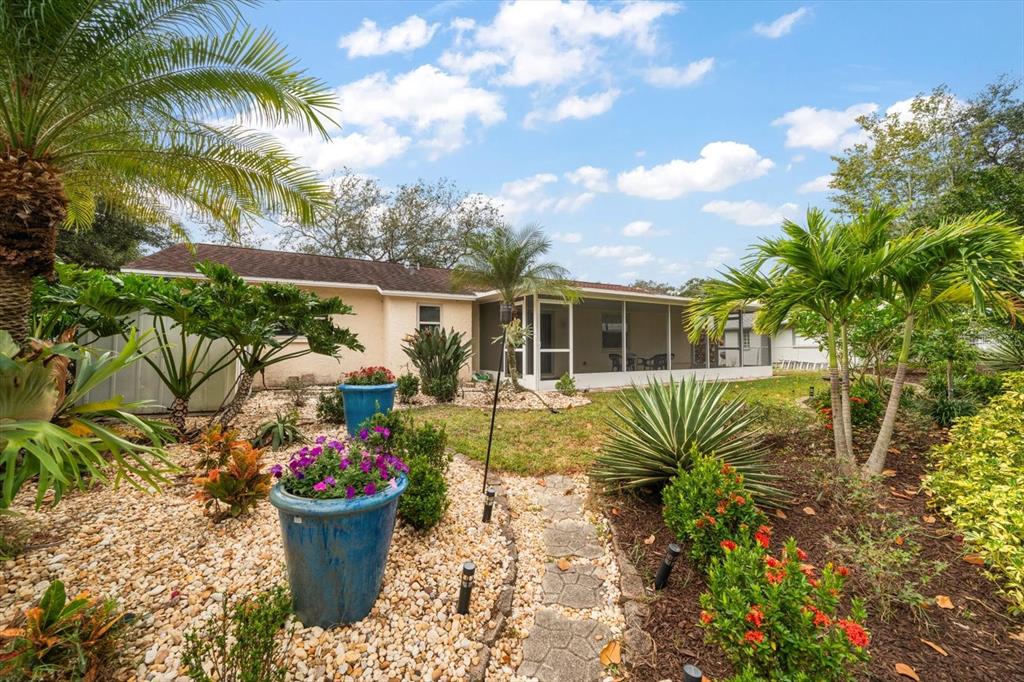 2850 Spring Lake Drive Clearwater, FL 33759 - Photo 28 of 37 a front view of a house with a garden