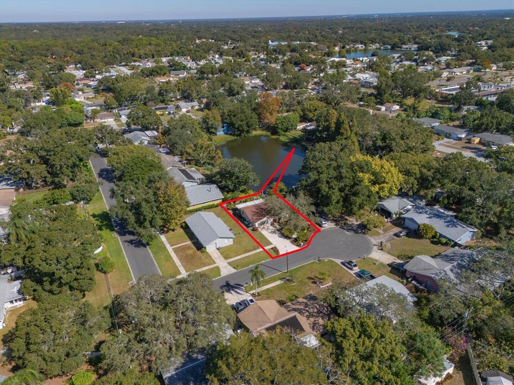 2850 Spring Lake Drive Clearwater, FL 33759 - Photo 32 of 37 an aerial view of residential houses with outdoor space and trees