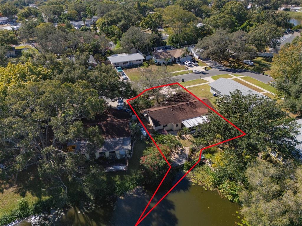 2850 Spring Lake Drive Clearwater, FL 33759 - Photo 33 of 37 an aerial view of residential house with outdoor space and trees all around