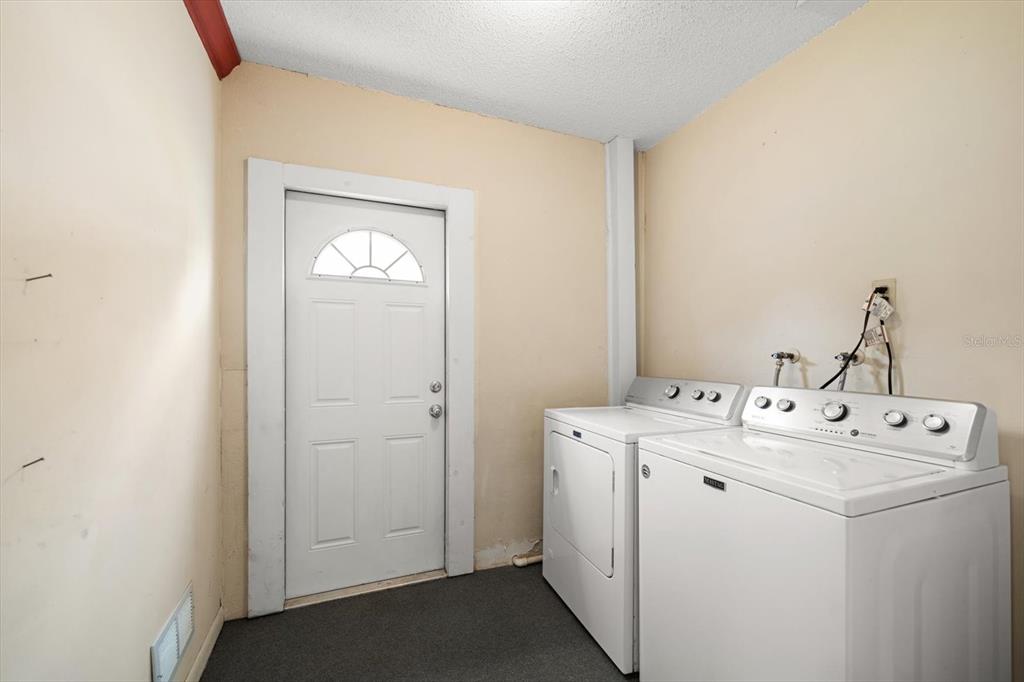 2850 Spring Lake Drive Clearwater, FL 33759 - Photo 5 of 37 a utility room with dryer and washer