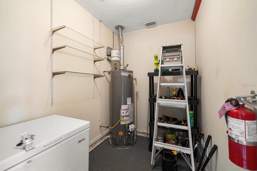 2850 Spring Lake Drive Clearwater, FL 33759 - Photo 7 of 37 a room with storage and utility