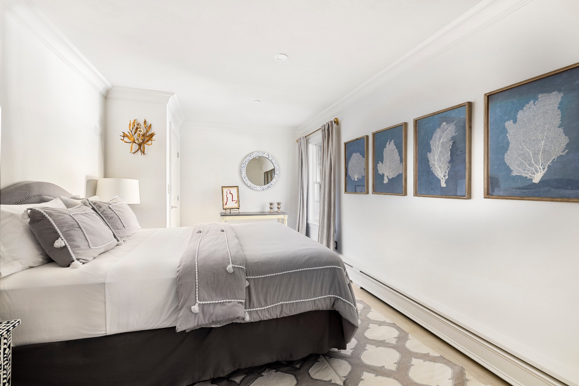 51 Jagger Lane Westhampton, NY 11977 - Photo 14 of 17 a bedroom with a bed and wall painting