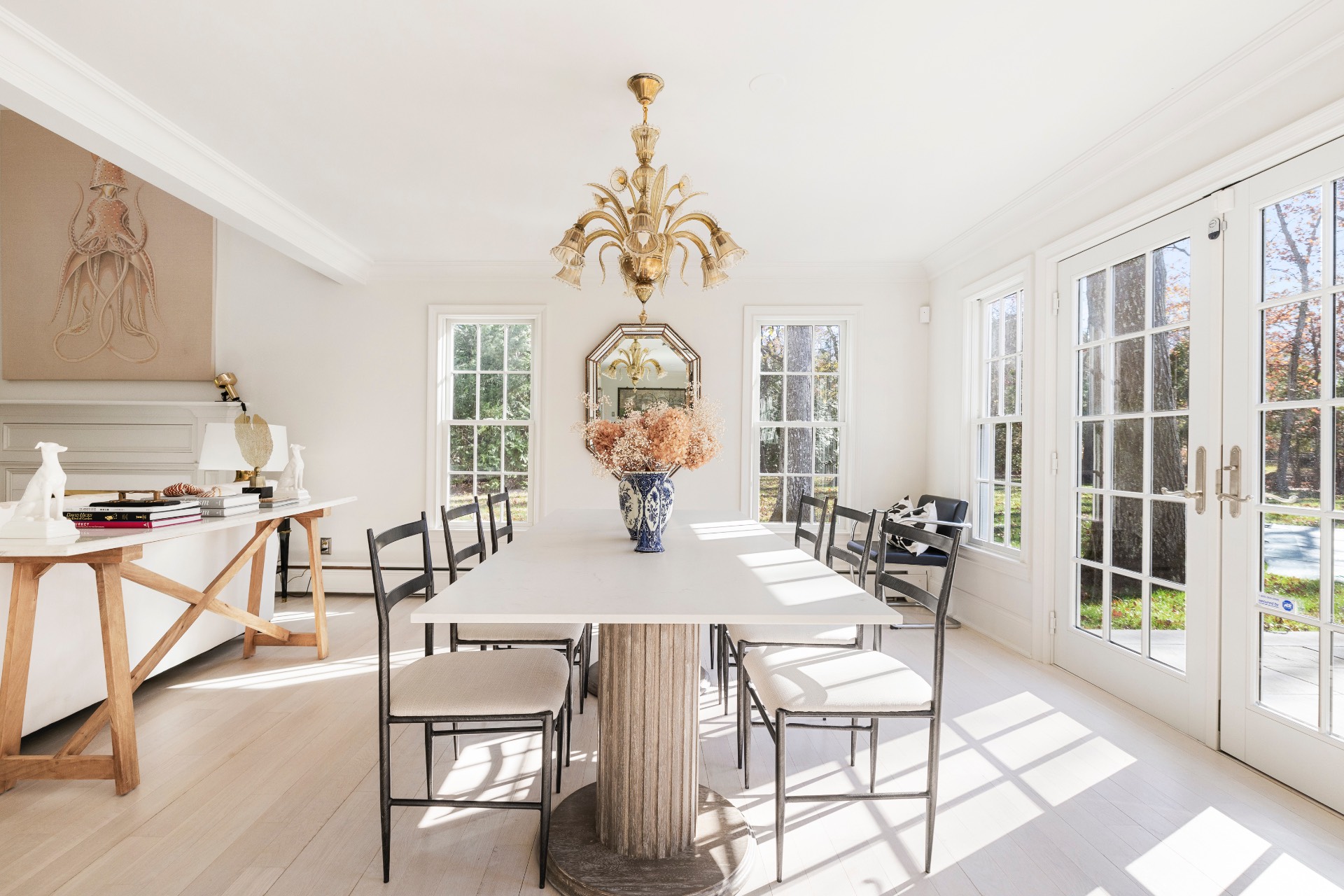 51 Jagger Lane Westhampton, NY 11977 - Photo 4 of 17 a view of a dining room with furniture and a chandelier